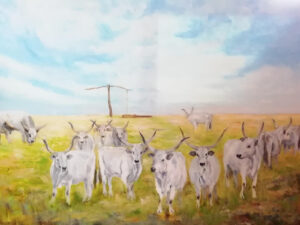 Legelésző szürkemarhák gémeskúttal